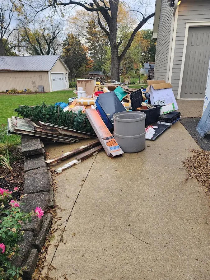 Dumpster being loaded with debris for Demolition Dumpster Rental in Fox Crossing